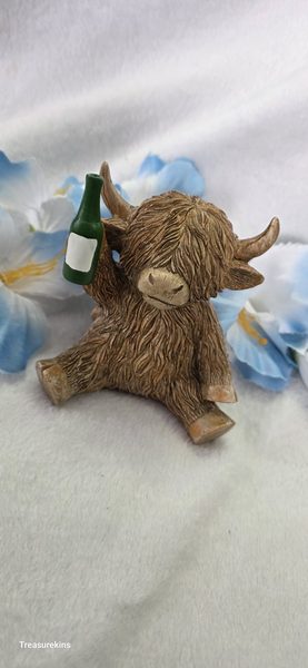 Happy Highland Cow with beer bottle figure