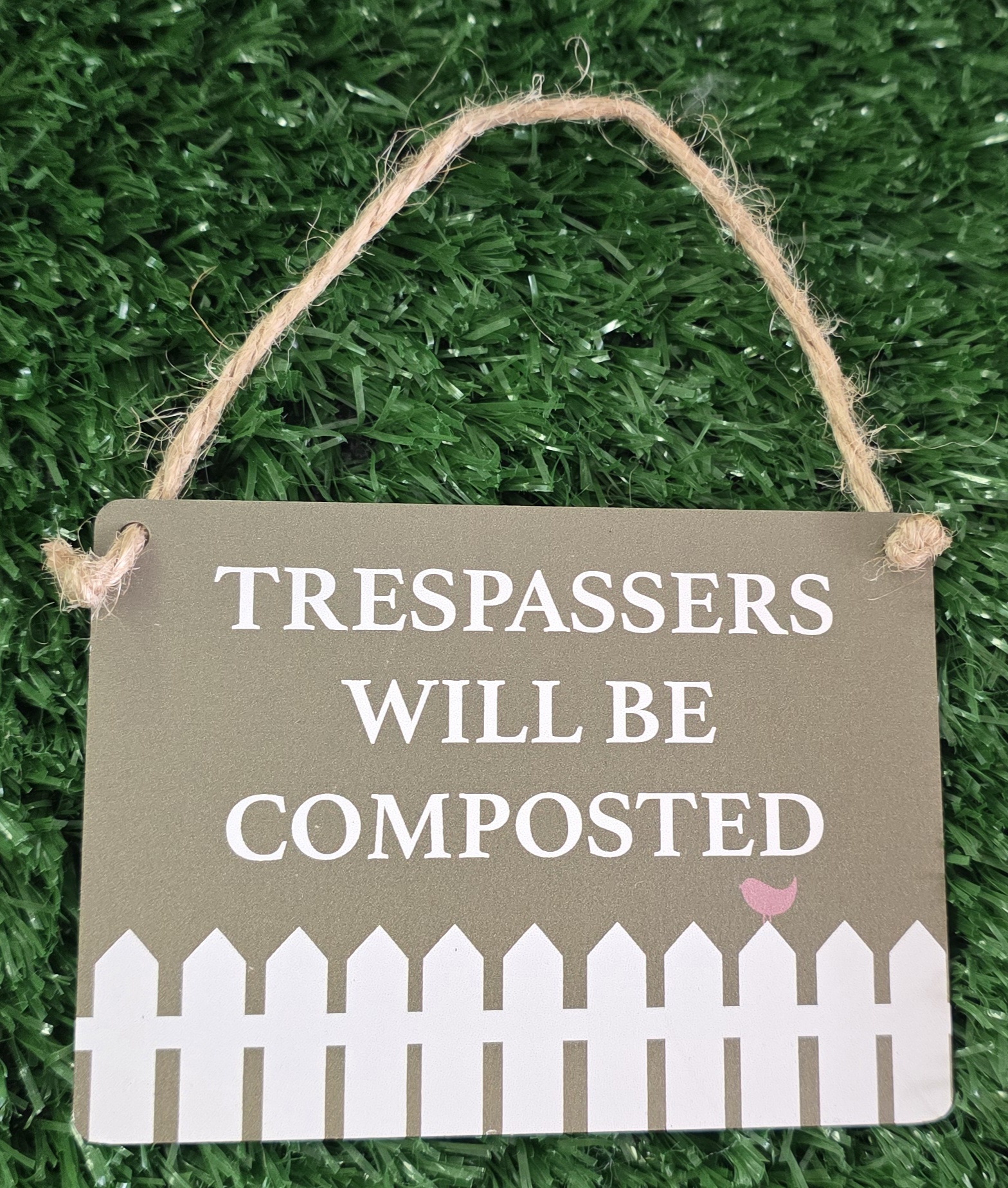 Mini Metal Hanging Plaque reading "TRESPASSERS WILL BE COMPOSTED"